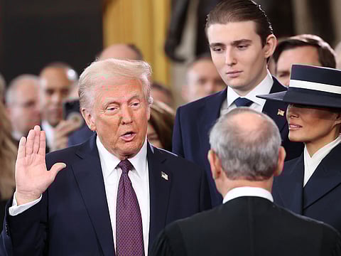 John Roberts, chief justice of the US Supreme Court, administers the oath of office to US President-elect Donald Trump, left, during the 60th presidential inauguration in the rotunda of the US Capitol in Washington, DC, US, on Monday, Jan. 20, 2025.