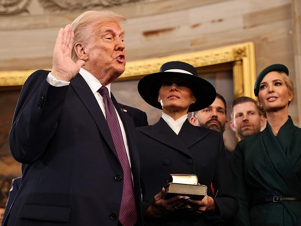 US President-elect Donald Trump takes the oath of office as Melania Trump, Ivanka Trump, Donald Trump Jr. and Eric Trump look on during inauguration ceremonies in the Rotunda of the U.S. Capitol on January 20, 2025 in Washington, DC. 