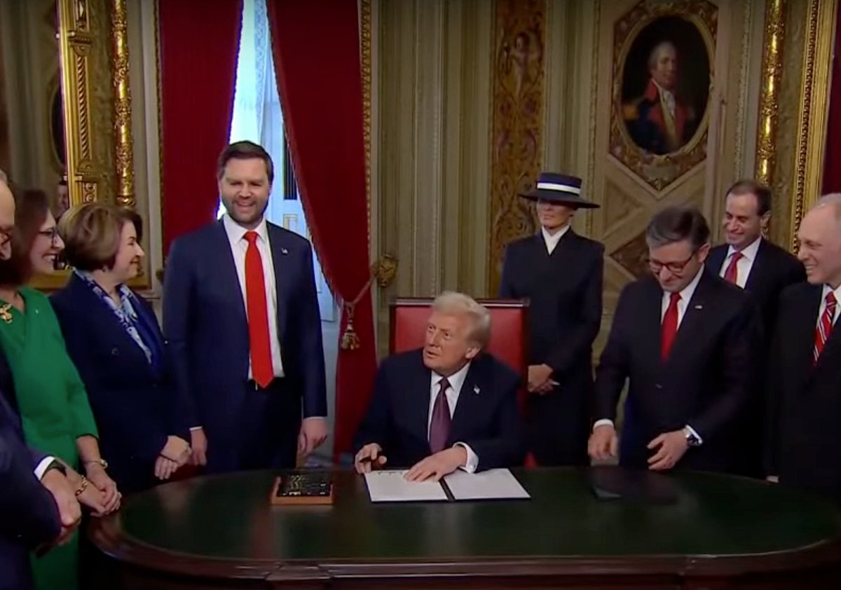 US President Donald Trump signs executive orders on his first day in the Oval Office on January 20, 2025.
