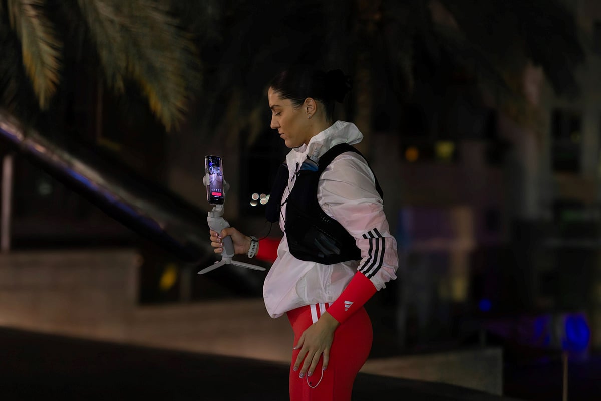 Lily Collyer sets out on the solo night marathon using a gimbal to livestream the 42km run in Dubai on January 16