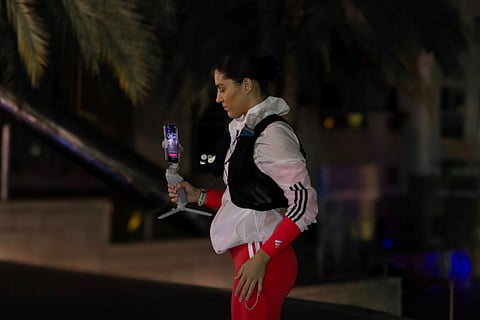 Lily Collyer sets out on the solo night marathon using a gimbal to livestream the 42km run in Dubai on January 16