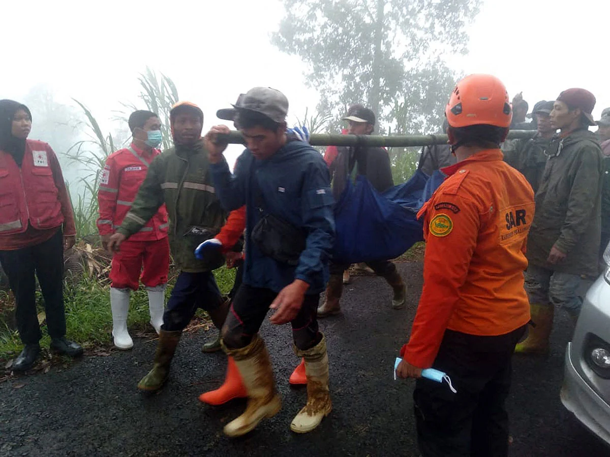 Rescueers and villagers evacuate victims of a landslide at Kasimpar Village in Pekalongan, Central Java, January 21, 2025
