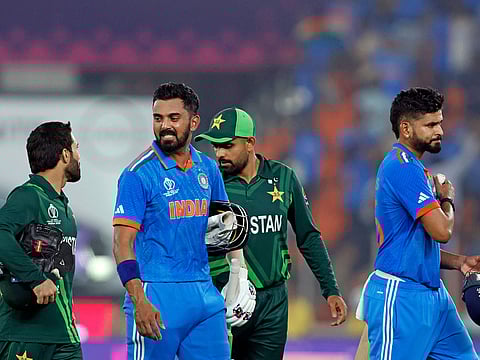 India's KL Rahul interacts with Pakistan's Mohammad Rizwan as Shreyas Iyer and Babar Azam walk back to the pavilion after their match in the ICC Men's Cricket World Cup 2023 in Ahmedabad in 2023.