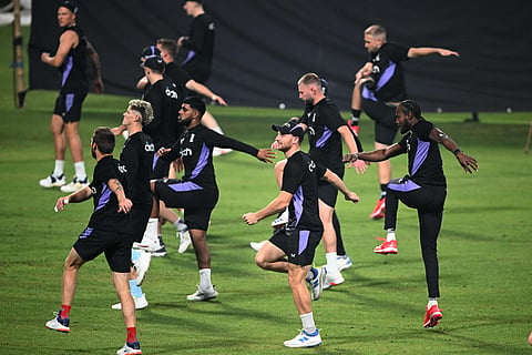 Englands captain Jos Buttler (centre) with other teammates attend a practice session ahead of their first Twenty20 international cricket match against India at the Eden Gardens in Kolkata on January 20.