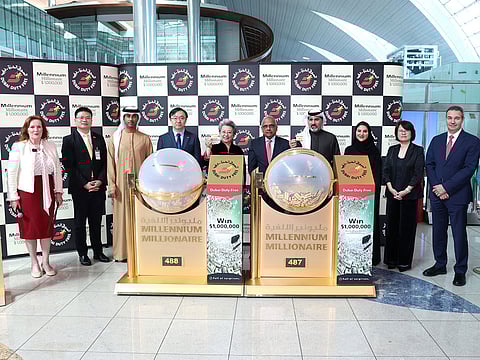 Officials from the Chinese Consulate and DDF with the winning tickets on Wednesday at Dubai airport