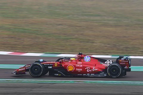 On a foggy morning at the Fiorano test track near Ferrari’s Maranello base in northern Italy, Hamilton shot out in a test car wearing the classic red overalls and a distinctive yellow helmet.
