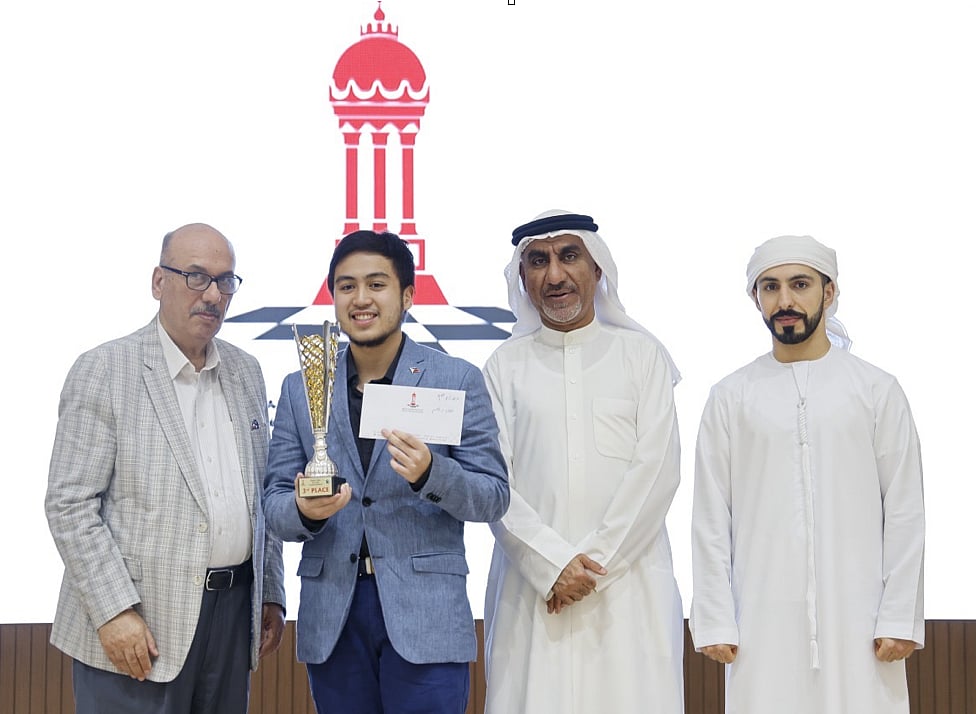 Santiago German (2nd from left) being awarded by (from left to right) Sharjah Cultural and Chess Club Executive Director Ragai Al Susi, UAE Chess Federation Strategic Director His Excellency Waheeb Jaafar Al Zarooni, and Chief Arbiter Salman Al Taher.