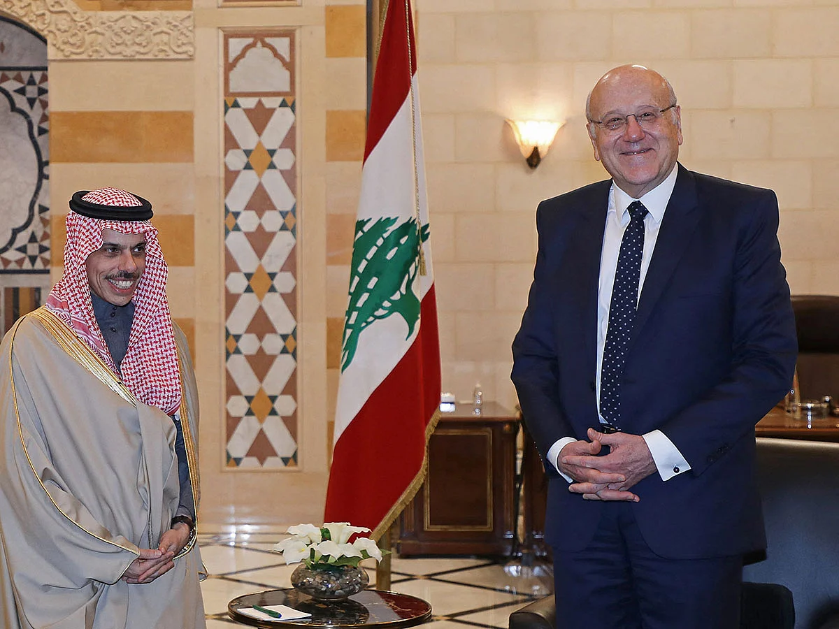 Faisal bin Farhan during his meeting with Lebanon's outgoing Prime Minister Najib Mikati (right) in Beirut on January 23, 2025.  