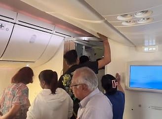 A video shared by an onboard passenger captures the frustration of fellow passengers.







