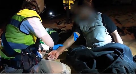 The video shows the crew providing treatment before airlifting the injured man to the hospital for further care.