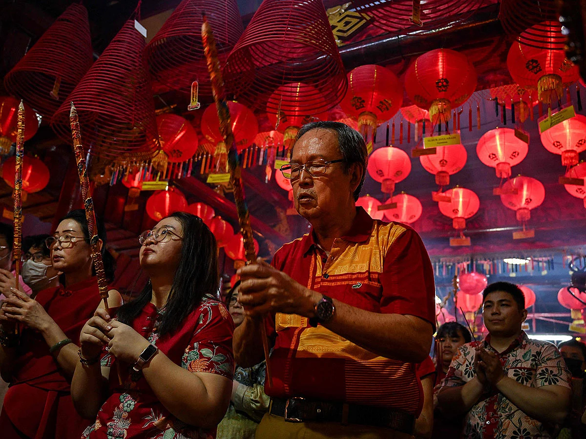 People offer prayers at the Hong San Koo Tee temple in Surabaya to mark the Lunar New Year of the Snake.
