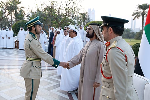 Sheikh Mohammed with top-performing graduates.