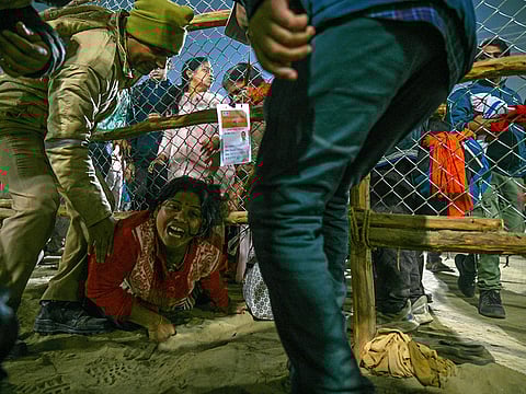 A devotee at the site of a stampede amid the ongoing Maha Kumbh Mela festival in Prayagraj on January 29, 2025. 