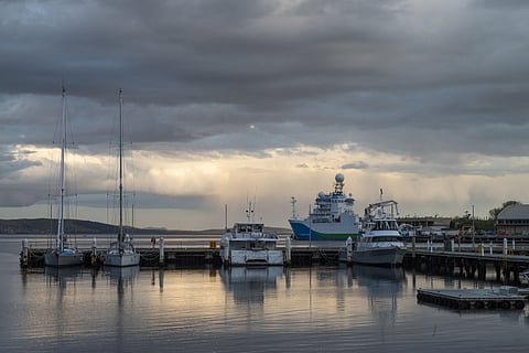 One of the tropical lows is expected to bring intense, gale-force winds and potentially life-threatening flooding along parts of Queensland’s coast from Friday evening