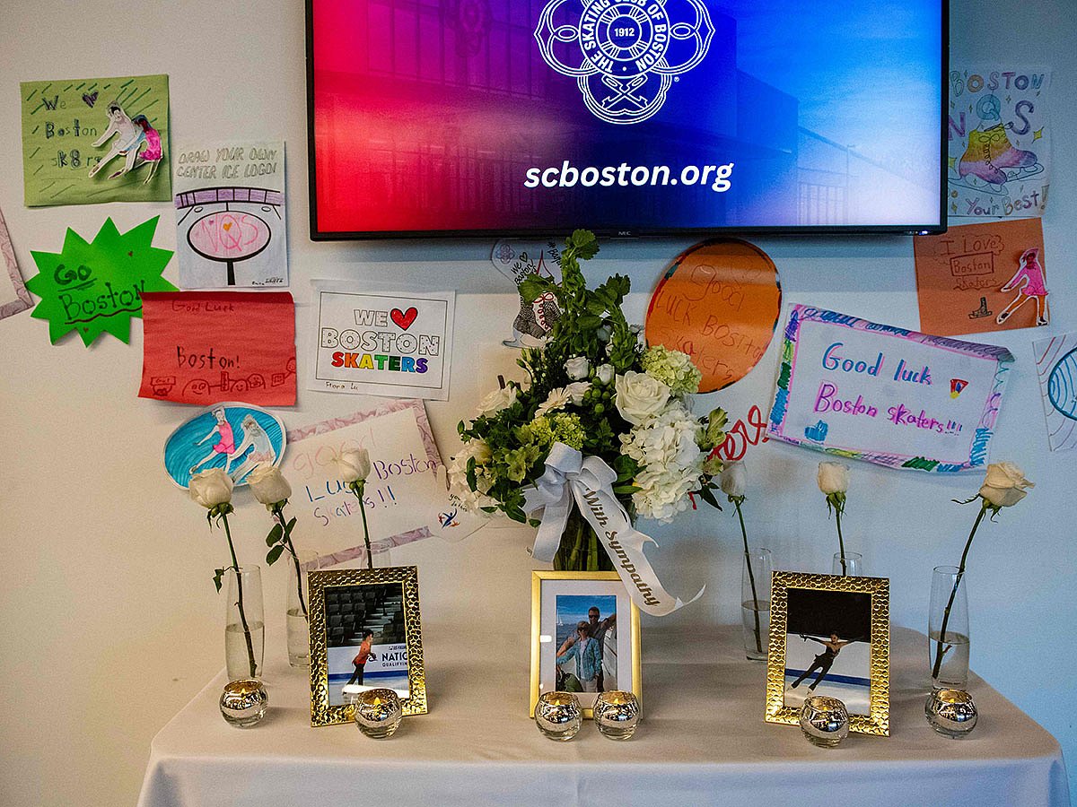 Sympathy flowers sit on a table alongside photos of people lost on American Airlines flight 5342 at the Skating Club of Boston in memory of the six Boston area skaters and their family members and coaches, in Norwood, Massachusetts on January 30, 2025.