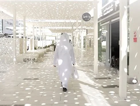 The walkway includes retail outlets, cafés, and outdoor seating areas that are designed for use throughout the year.