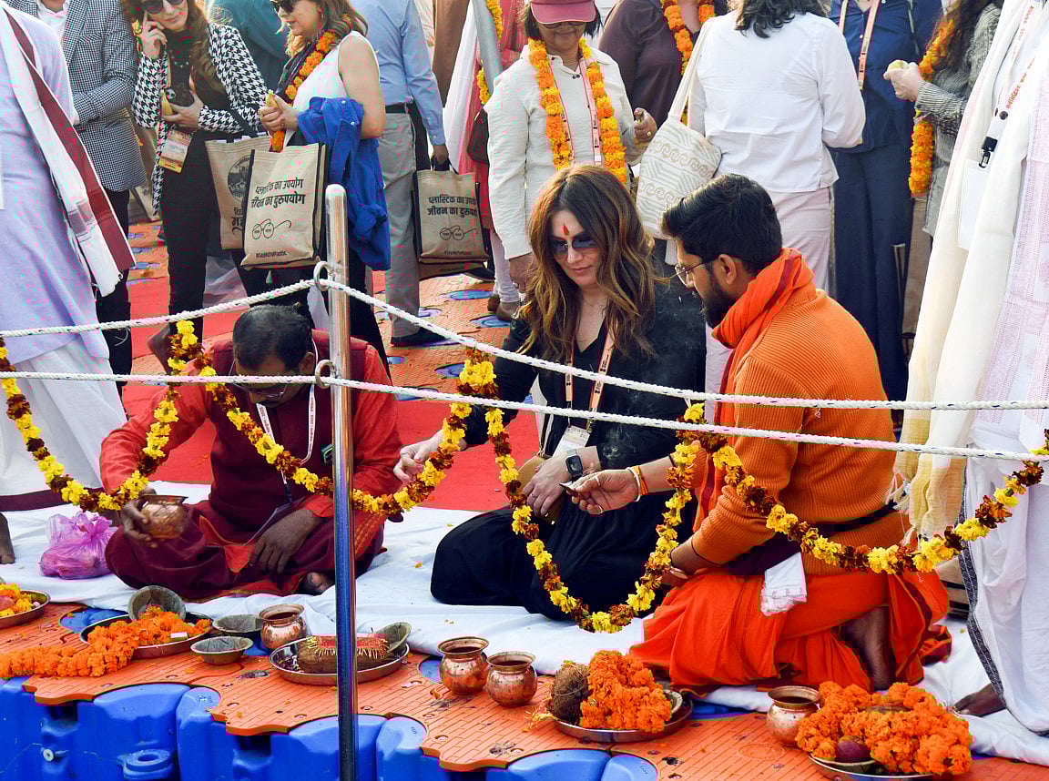 Foreign diplomats perform rituals at Triveni Sangam during the ongoing Maha Kumbh 2025, in Prayagraj on Saturday.  