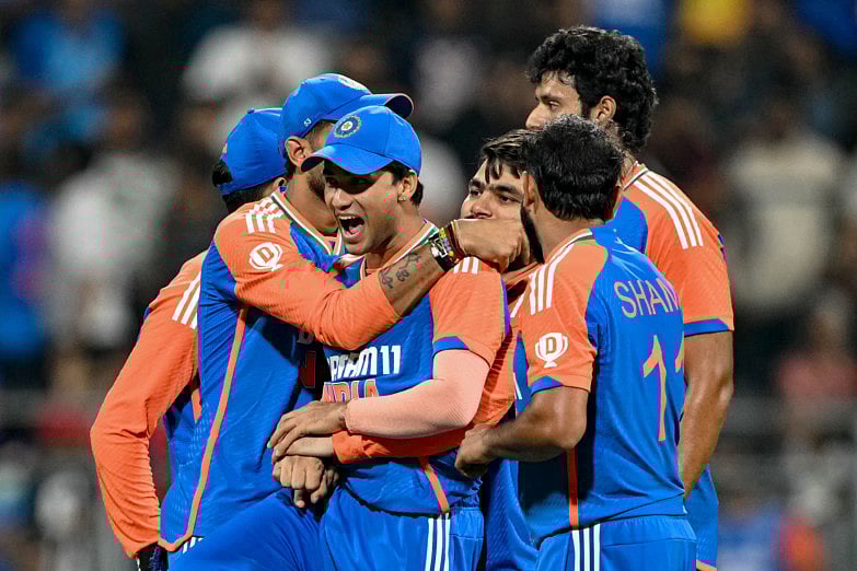 Indian players celebrate after winning the fifth Twenty20 match against England at Wankhede Stadium in Mumbai on Sunday. The victory propelled the hosts to a 4-1 triumph in the series. 