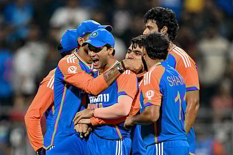Indian players celebrate after winning the fifth Twenty20 match against England at Wankhede Stadium in Mumbai on Sunday. The victory propelled the hosts to a 4-1 triumph in the series. 