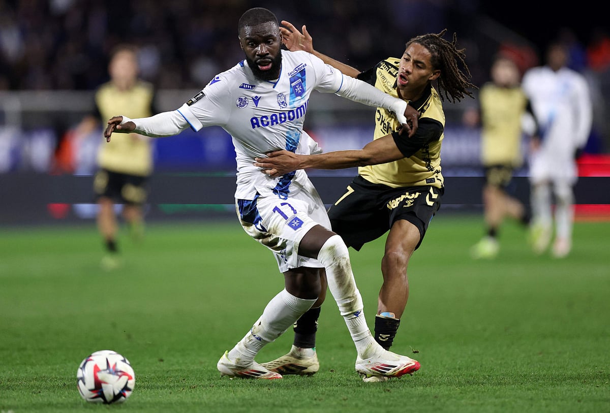 Amougou (right) made his debut for Saint-Etienne at the start of last season and featured in Ligue 2 as the club secured promotion to the French top flight.