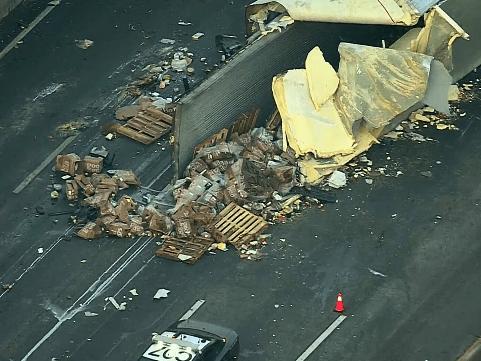Boxes of eggs spill onto the road.