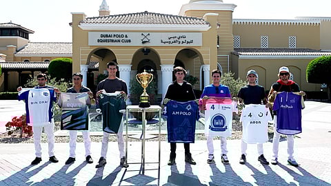 Members of the seven teams with the prestigious Dubai's Emaar Polo Cup at the Dubai Polo & Equestrian Club on Tuesday.