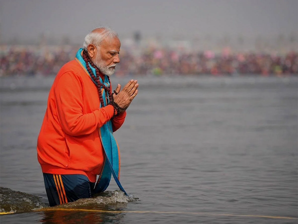India's Prime Minister Narendra Modi takes a holy dip at the Samgam as part of his visit to the Maha Kumbh.