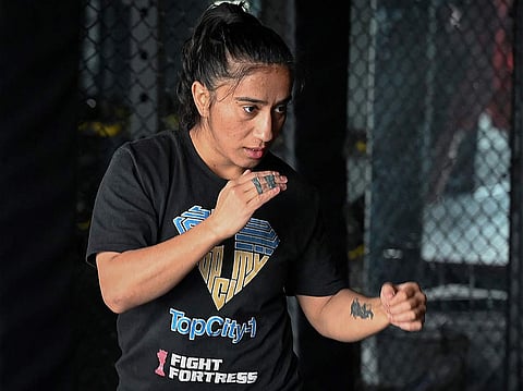Anita Karim, a mixed martial arts (MMA) fighter, takes part in a training session at a club in Islamabad, in this photograph taken on December 11, 2024