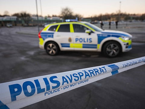 Police officers stand guard outside the adult education center Campus Risbergska school in Orebro, Sweden, on February 6, 2025, two days after a shooting there left eleven people dead. 