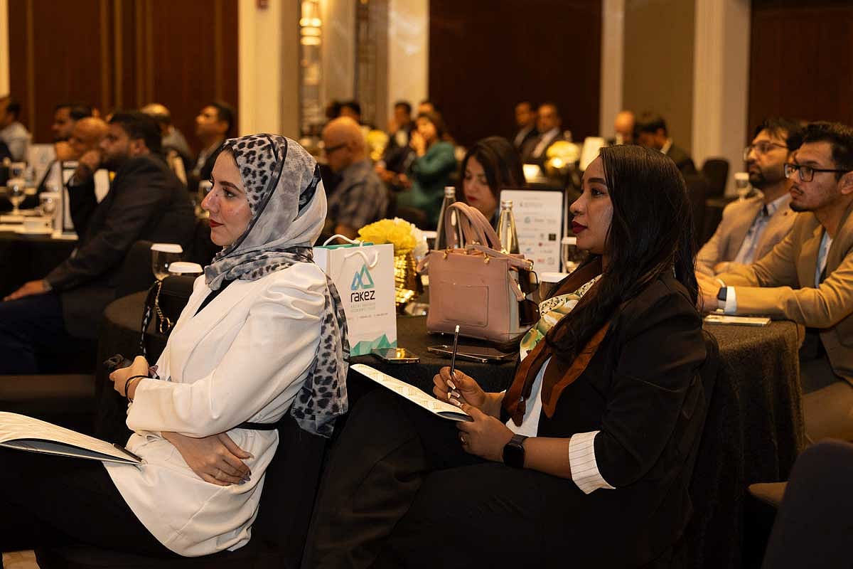 Speakers listening to experts at the Invest UAE seminar