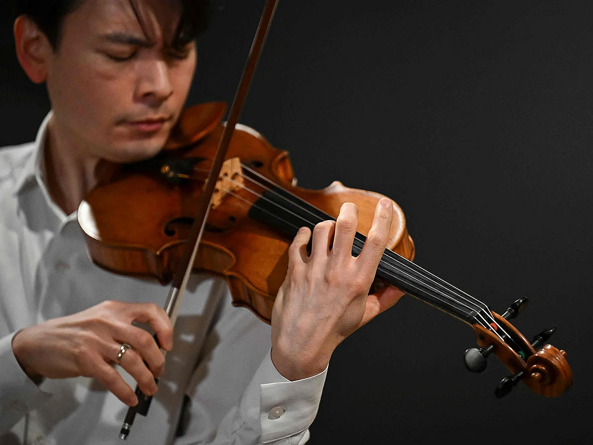 Classical US violinist Stefan Jackiw plays the Joachim-Ma Stradivarius violin during a preview of the violin's auction at Sotheby’s in New York City on February 3, 2025.