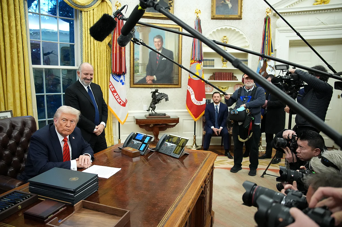S. President Donald Trump, joined by Commerce Secretary Howard Lutnick, signs a series of executive orders in the Oval Office at the White House on February 10, 2025 in Washington, DC. 