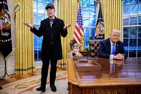 Tesla and SpaceX CEO Elon Musk, accompanied by US President Donald Trump (R), and his son X Musk, speaks during an executive order signing in the Oval Office at the White House on February 11, 2025 in Washington, DC. 