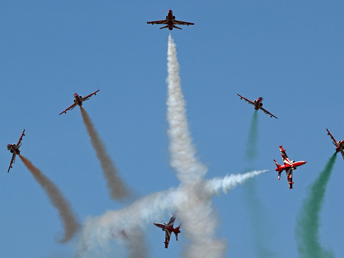 The Indian Air Force (IAF) Surya Kiran aerobatics team performs during Aero India 2025, a military aviation exhibition at the Yelahanka Air Force Station in Bengaluru on February 12, 2025.