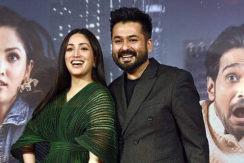 Bollywood actress Yami Gautam (L) with her husband and film producer Aditya Dhar. 