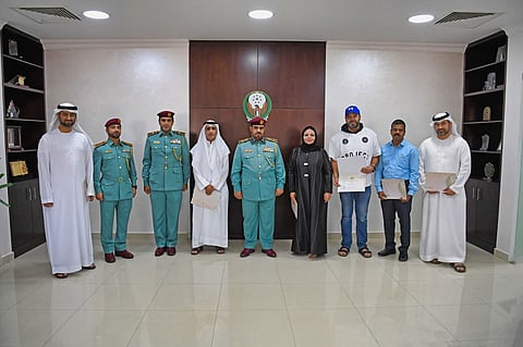 Ajman Police with some community members who made a difference by reporting traffic violations.