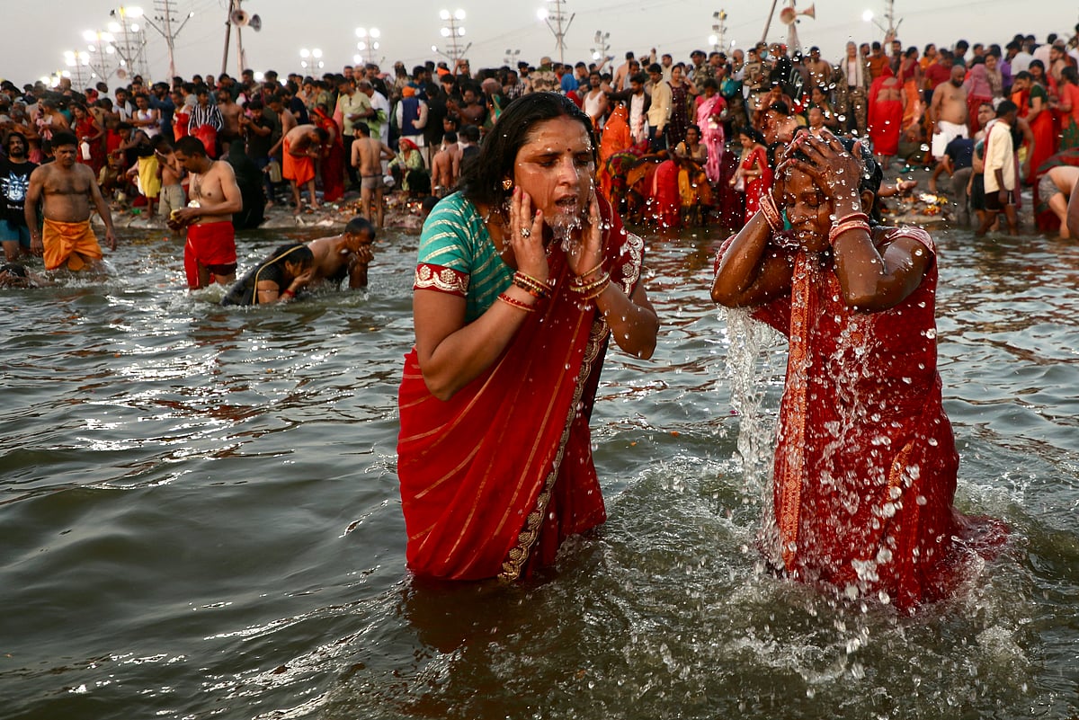 Pilgrims take a holy dip in Sangam, the confluence of Ganges, Yamuna and mythical Saraswati rivers, on the occasion of Maghi Purnima during the Maha Kumbh Mela festival in Prayagraj.