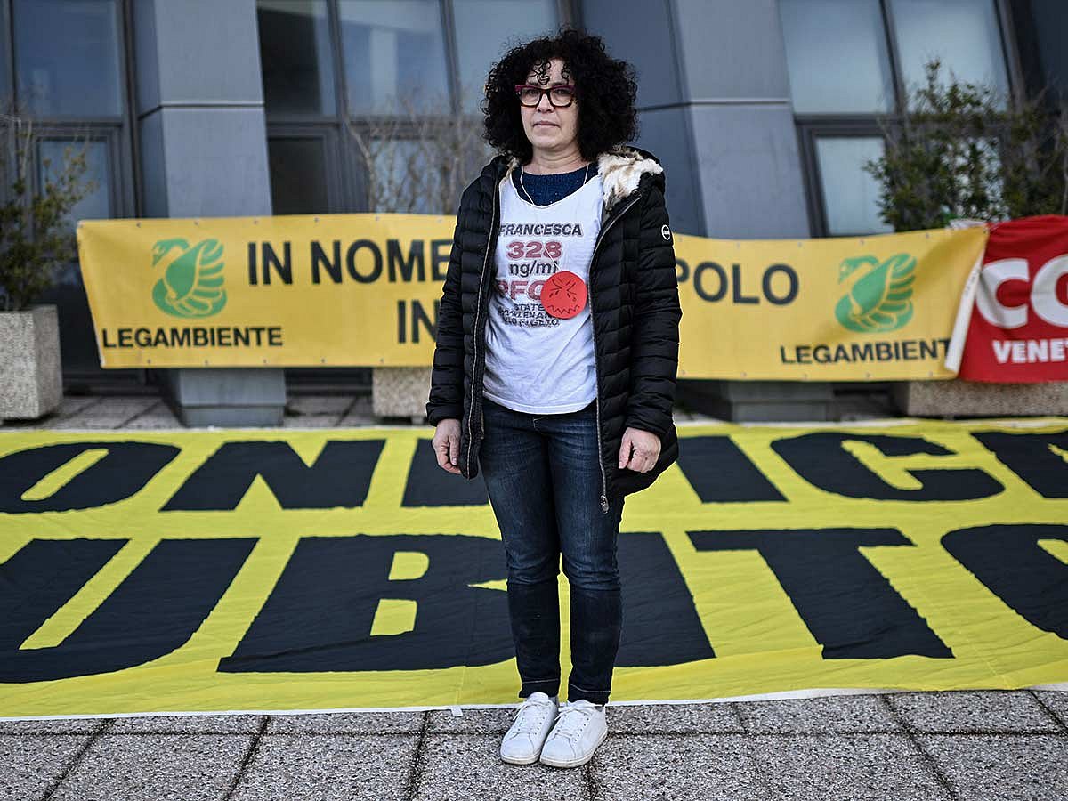 Giovanna Dal Lago, a member of "No Pfas Mothers" association, poses during a demonstration in front of the Vicenza courthouse, where the trial against the Miteni company, responsible for having polluted the area is underway in Vicenza, Northeastern Italy, on February 7, 2025.