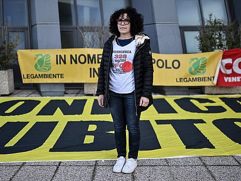 Giovanna Dal Lago, a member of "No Pfas Mothers" association, poses during a demonstration in front of the Vicenza courthouse, where the trial against the Miteni company, responsible for having polluted the area is underway in Vicenza, Northeastern Italy, on February 7, 2025. 