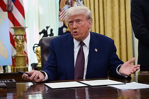 US President Donald Trump speaks in the Oval Office of the White House as he announces reciprocal tariffs, in Washington, DC, on February 13, 2025.