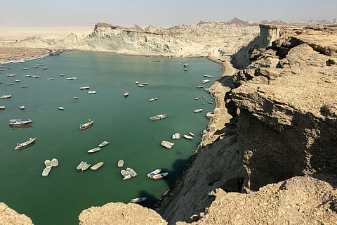 A man walks at the "Mars Mountains" site near Chabahar in Iran's southern Makran region, in the Sistan-Baluchistan province, on May 12, 2015.