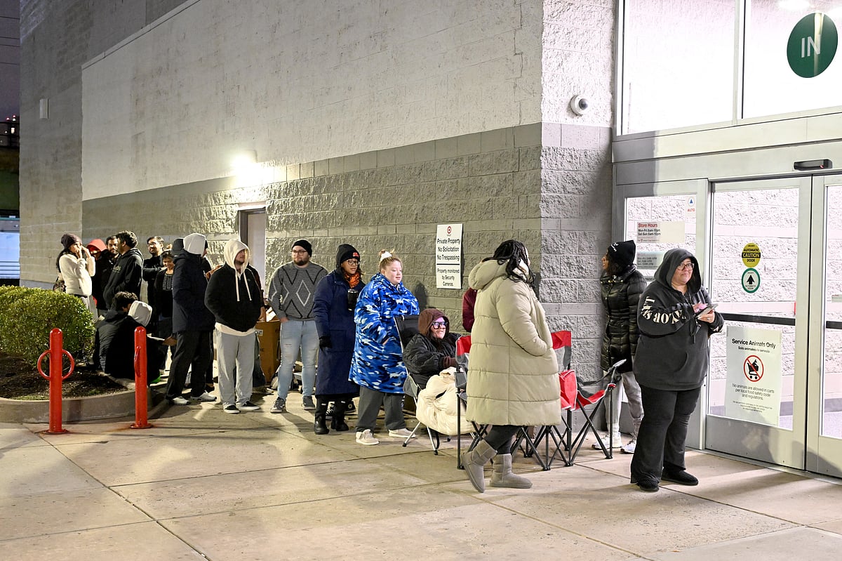 Guests wait in line outside to shop Target Black Friday Deals and Taylor Swift Exclusive Products on November 29, 2024 in Jersey City, New Jersey.