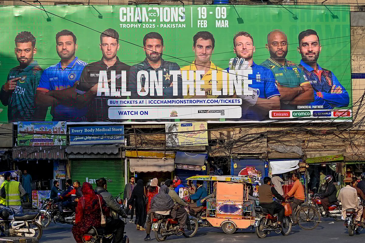 A billboard depicts Indian captain Rohit Sharma (2L) ahead of Champions Trophy in Lahore on February 15, 2025.