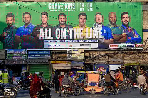 A billboard depicts Indian captain Rohit Sharma (2L) ahead of Champions Trophy in Lahore on February 15, 2025.