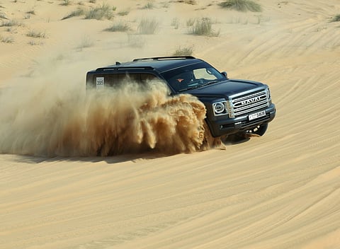 A GWM Haval H9 tackles the challenging dunes of Tilal Swaihan during the Gulf News Overnighter Fun Drive. 