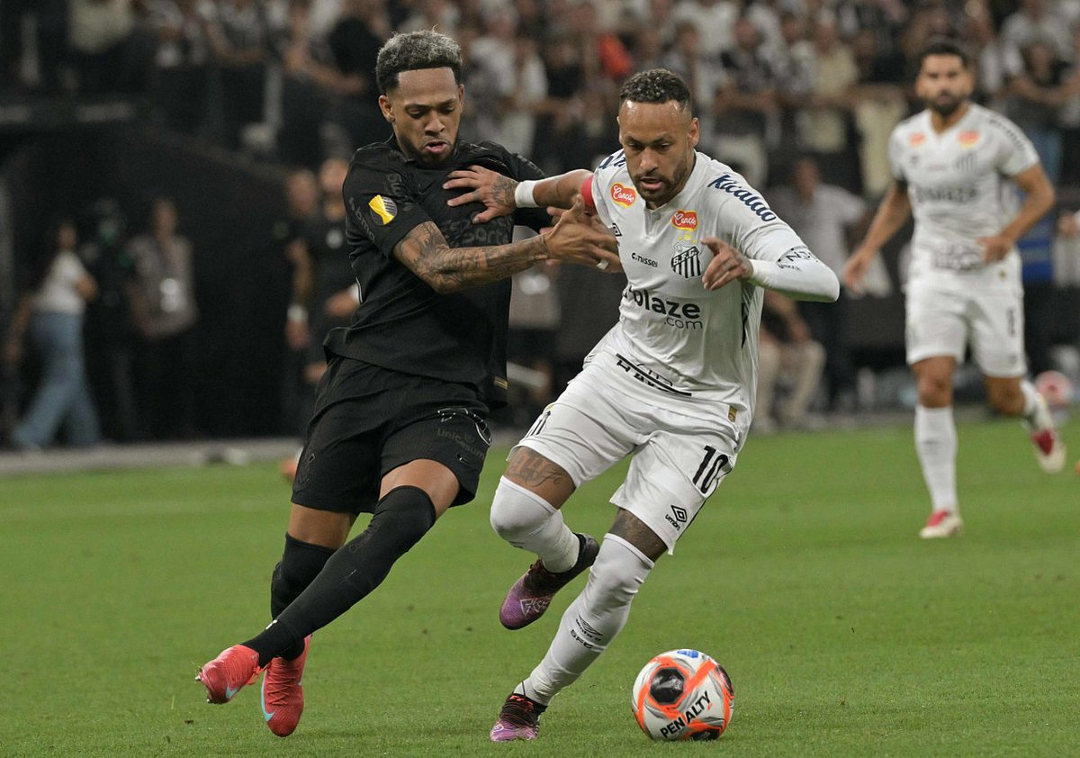 Santos' forward Neymar and Corinthians' Venezuelan midfielder Jose Martinez fight for the ball during the Campeonato Paulista A1 football match at Arena Corinthians in Sao Paulo on February 12.