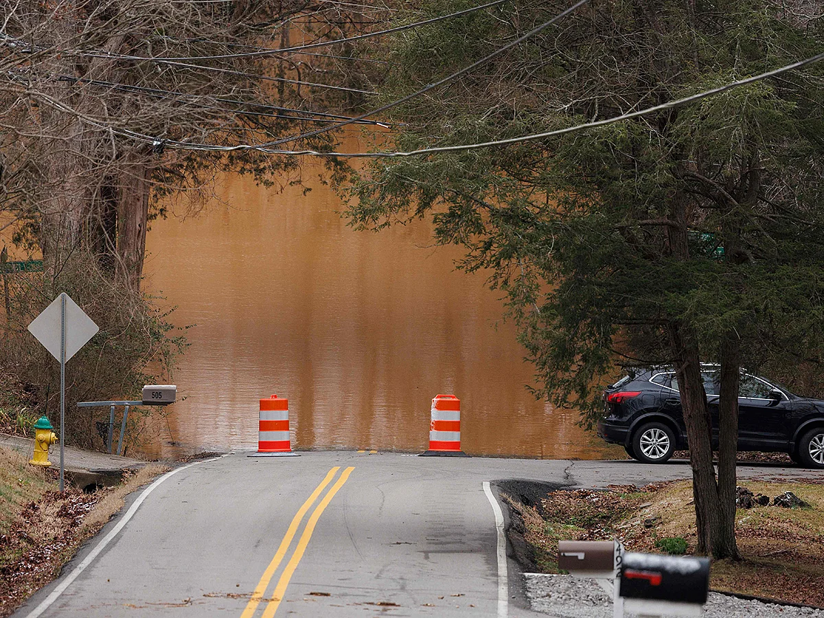 Cars are unable to pass on a flooded road after a rainstorm on February 16, 2025 in Clarksville, Tennessee. 