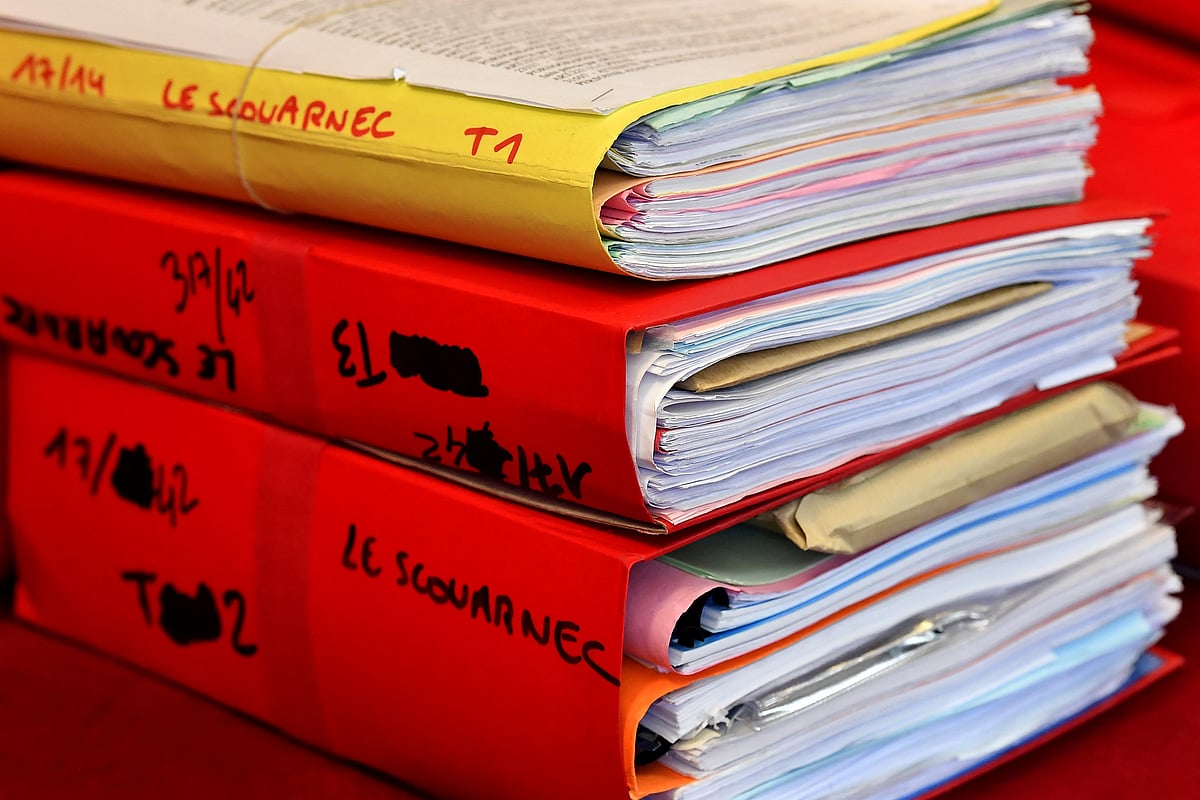 Files are displayed in the courtroom during the opening day of French surgeon Joel Le Scouarnec' s trial for the rape and sexual abuse of four child at the courthouse in Saintes, western France, on March 13, 2020.