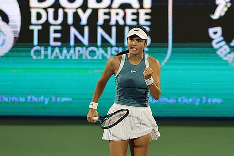 Emma Raducanu celebrates a point during her first round match against Maria Sakkari in Dubai.