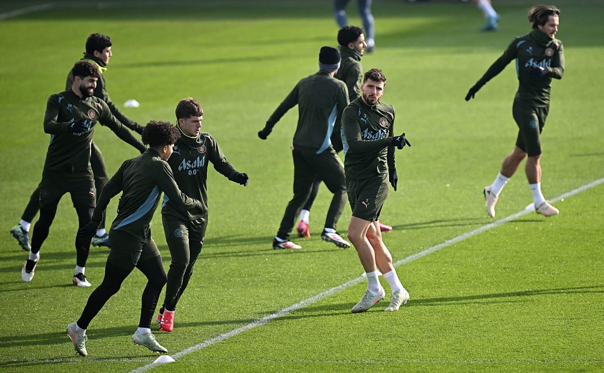 Manchester City's Croatian defender Josko Gvardiol (left), English defender Rico Lewis (3L), Portuguese defender Ruben Dias (2R) and English midfielder Jack Grealish take part in a training session at Manchester City's training ground in Manchester, north-west England, on February 18.